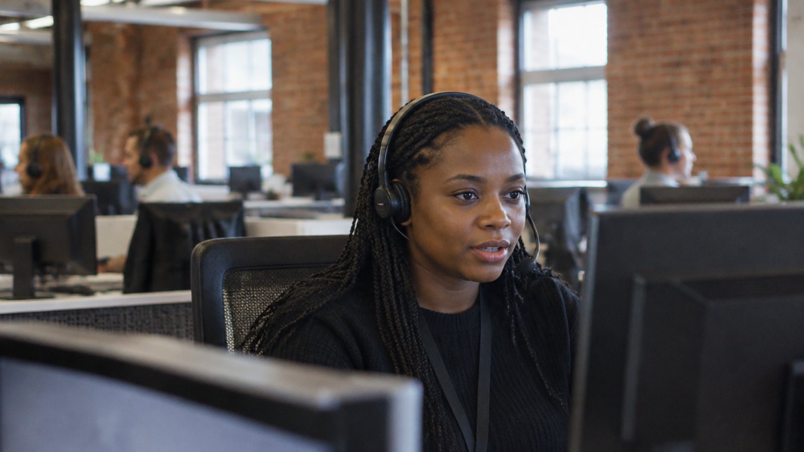 British call centre adviser working with an AI assistant